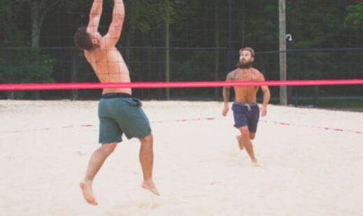 men playing beach volleyball at sportscenter