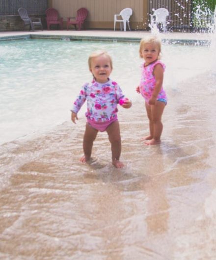 babies enjoying splash park at sportscenter