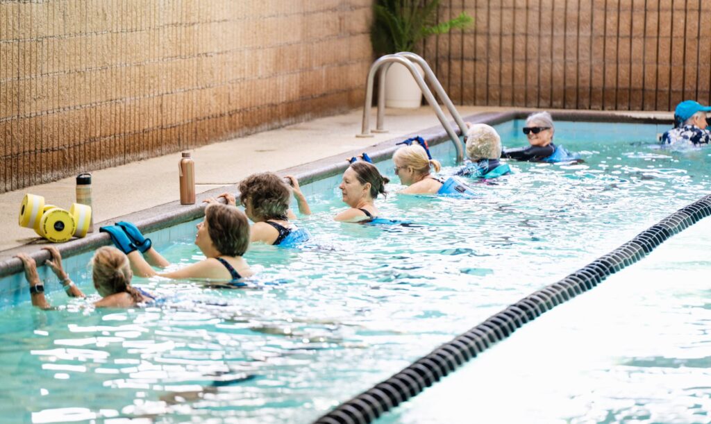 Group exercise in indoor swimming pool